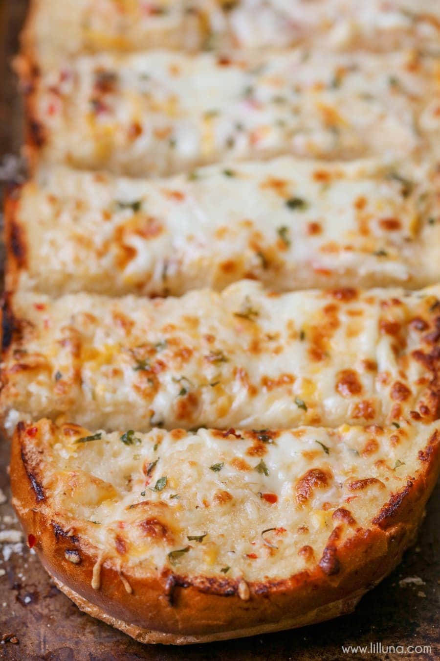 Serve crock pot mac and cheese with cheesy garlic bread.