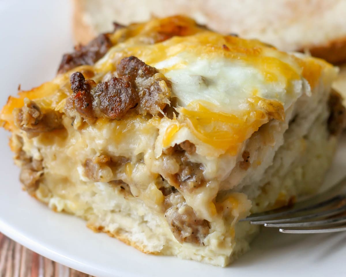 Breakfast casserole recipes - a square slice of biscuit egg casserole on a plate.