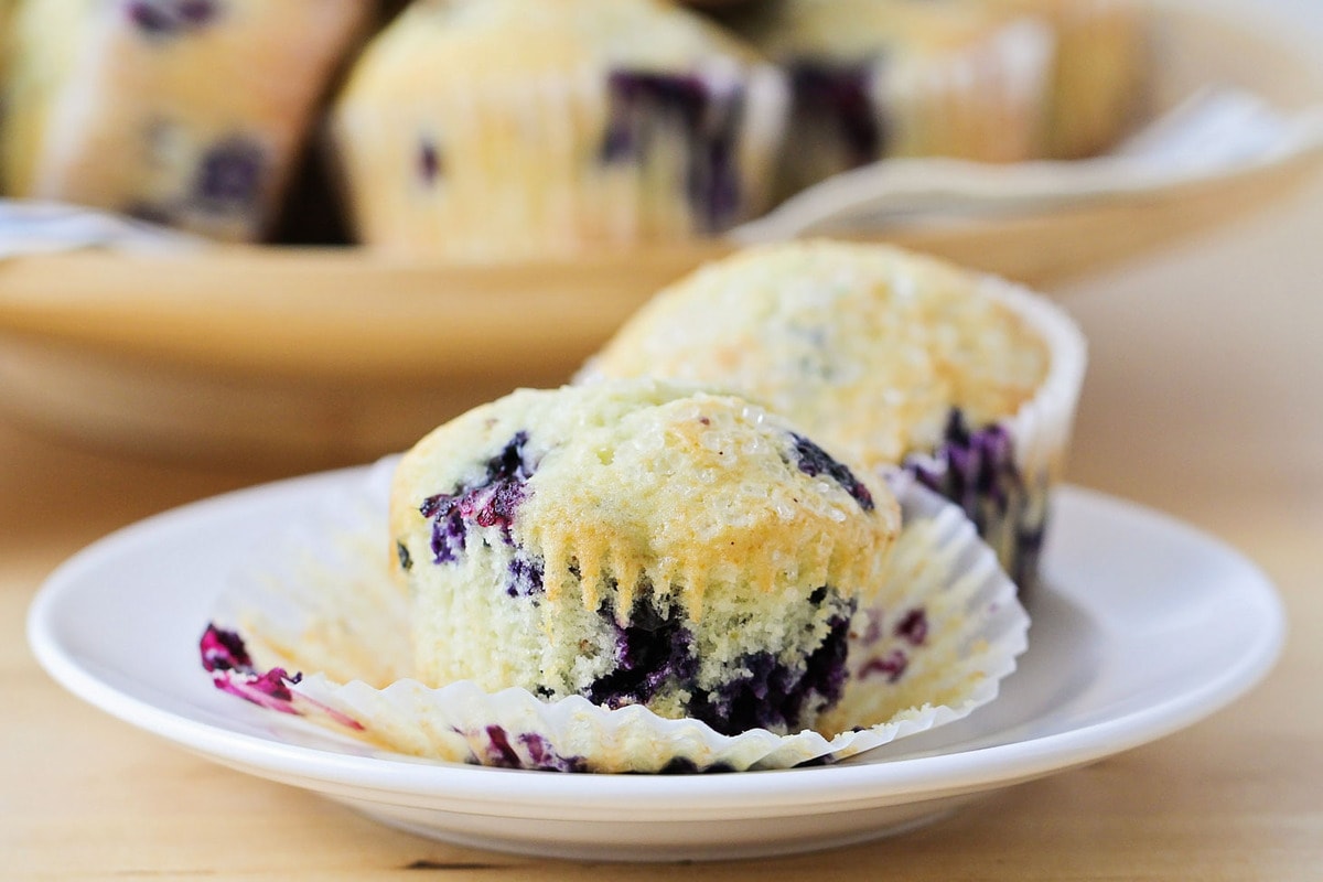 Easy Breakfast Ideas - blueberry muffins on a white plate.